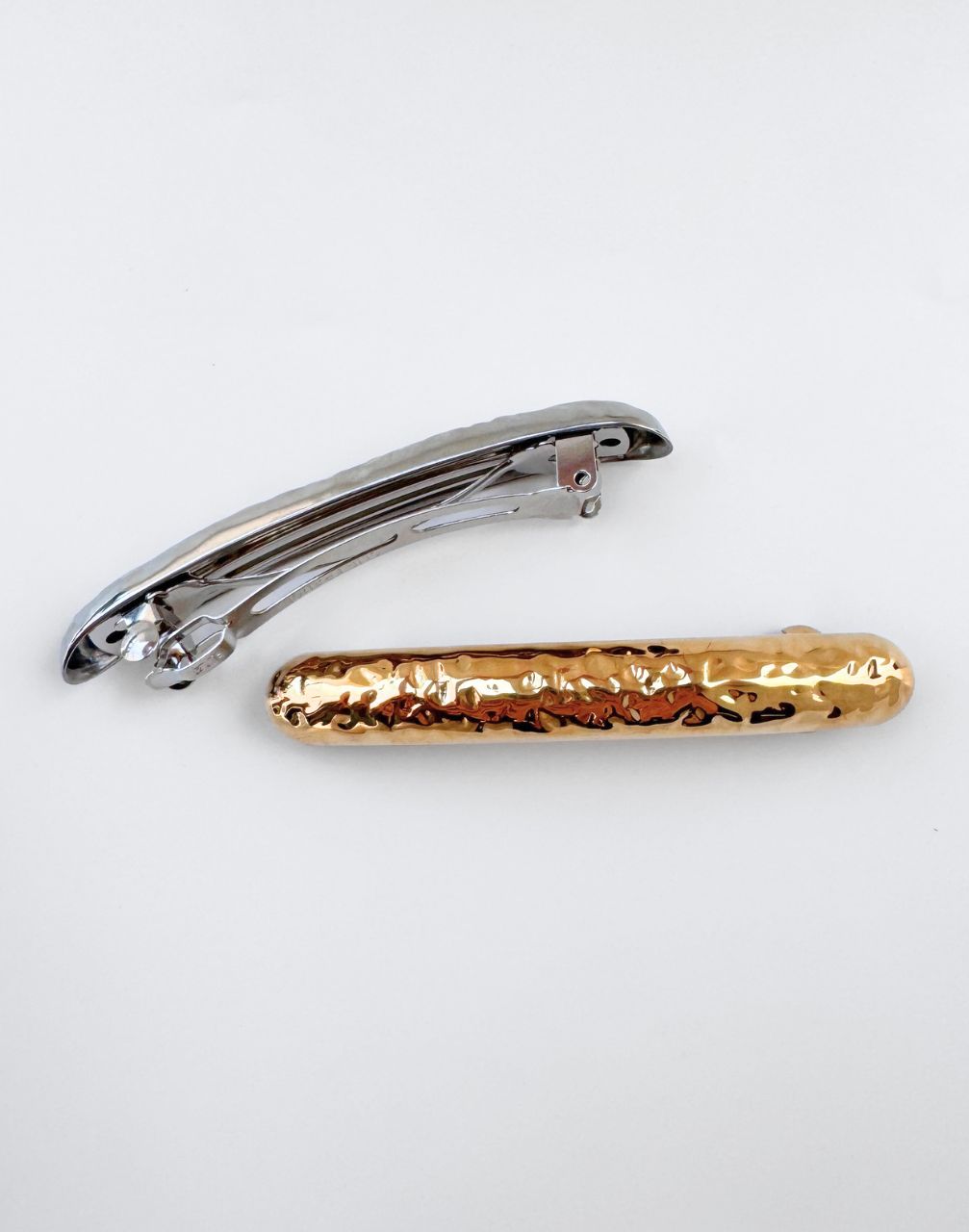 gold and silver hair barrettes
